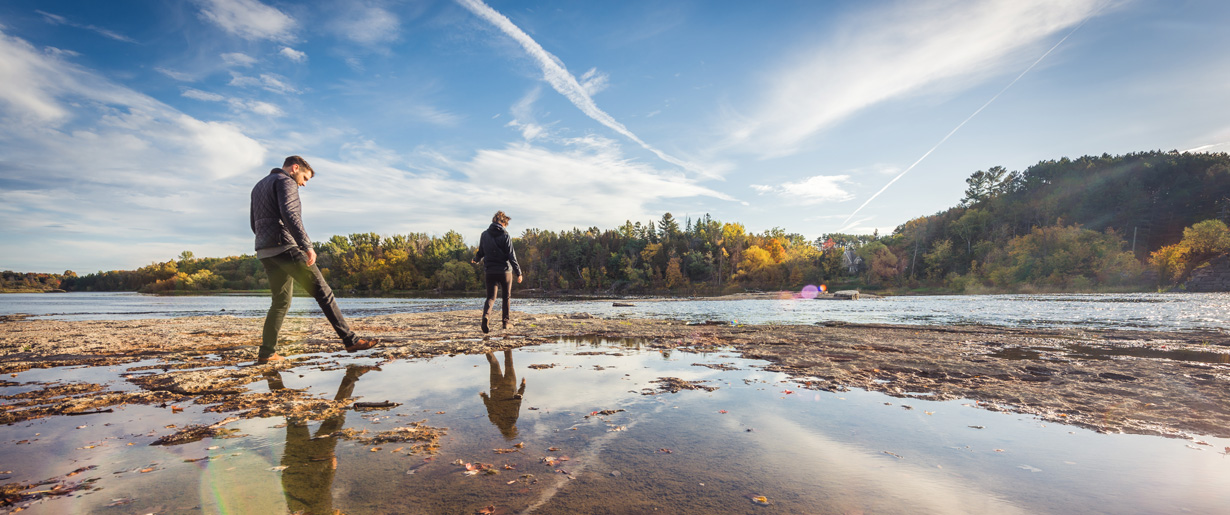 A couple walking through the shallow water