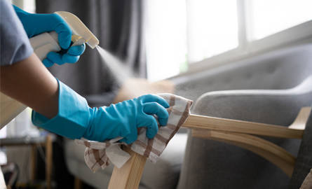 Woman cleaning chair