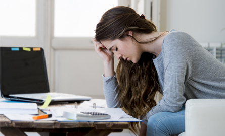 Woman looking at her bills