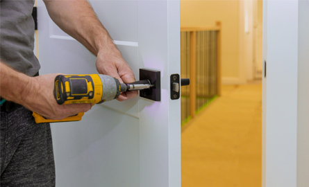 Man installing door