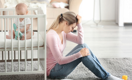 Woman with a baby in a crib