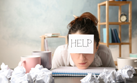 Woman with help sign on her forehead