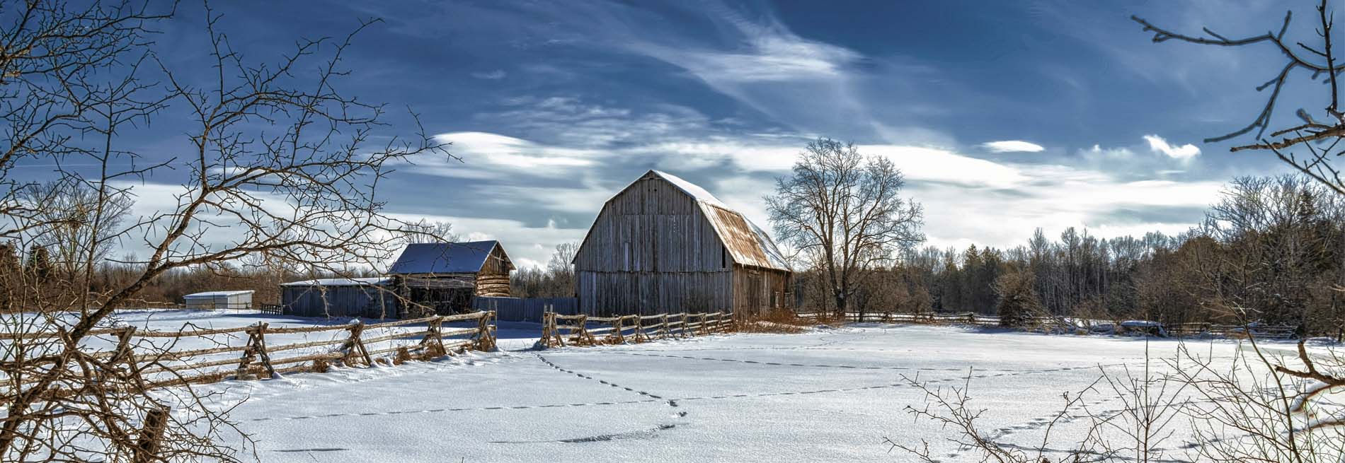 a barn in a winter field