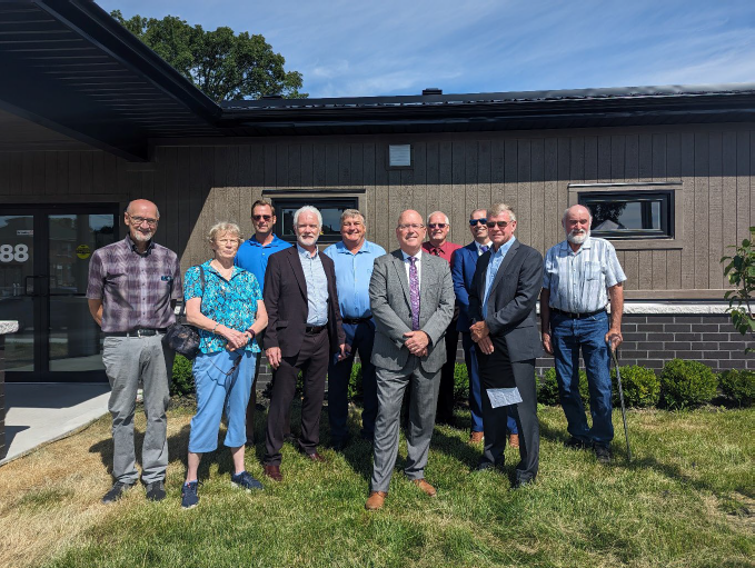 a group of officials at the opening of the new community housing