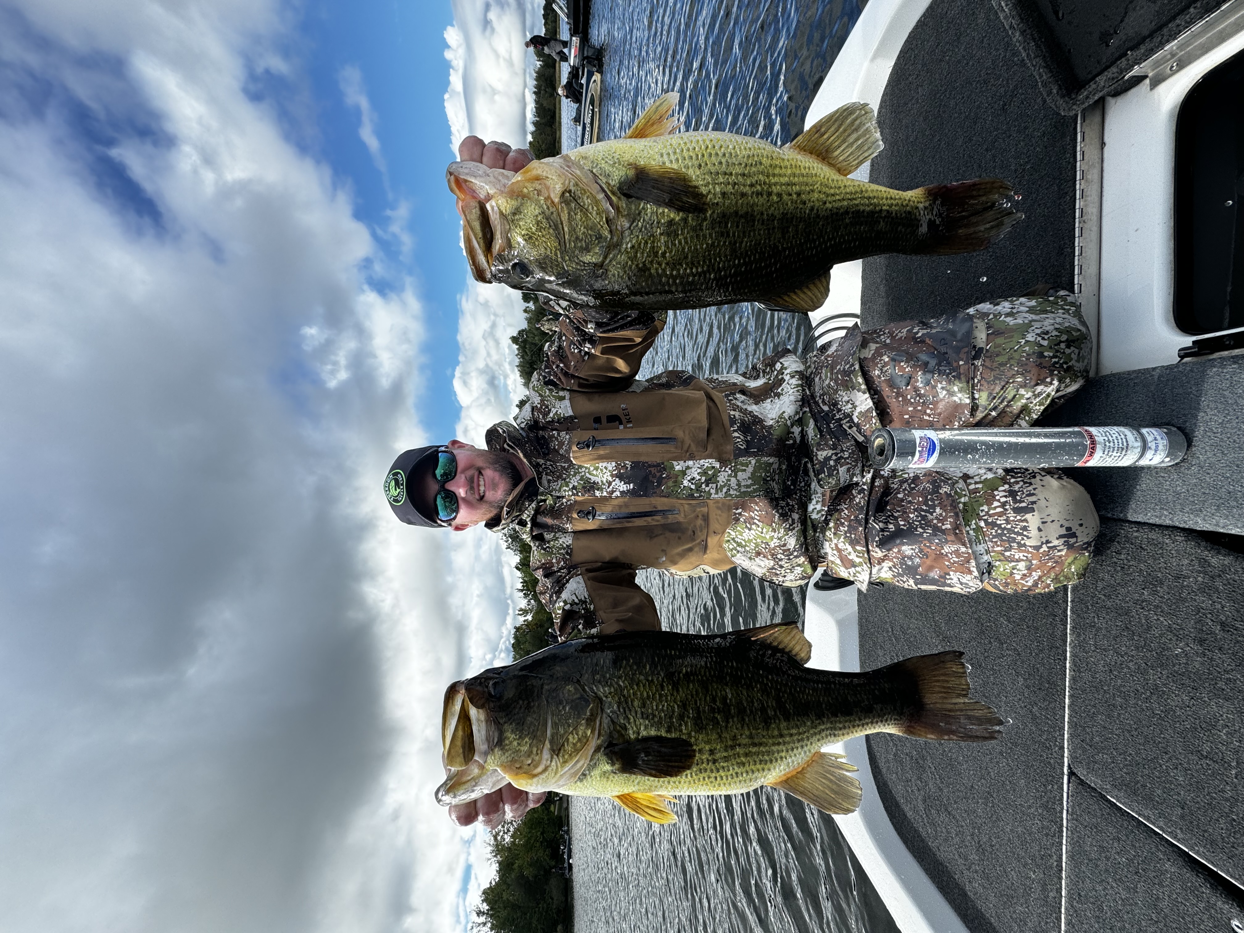Man holding two fish.