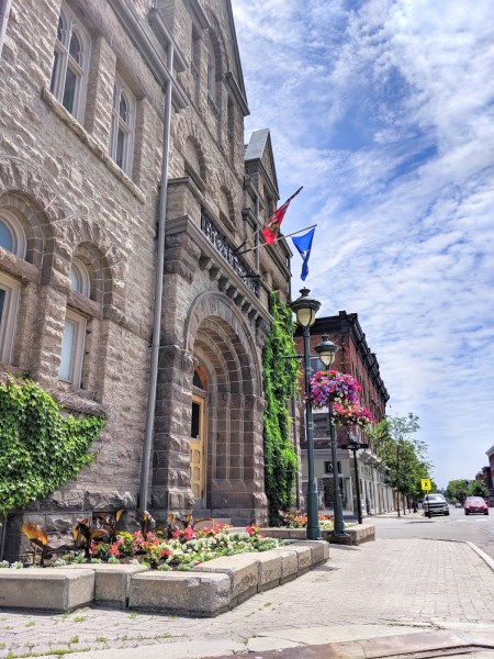 a girl in front of carleton place town hall