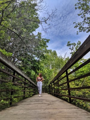 a girl walking in a trail