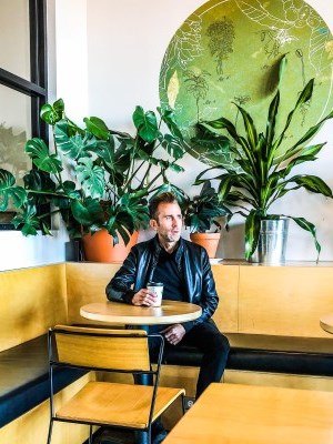 a man having a cup of coffee