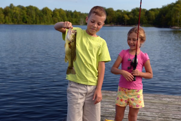 two kids catch a fish