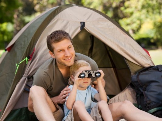 a father go camping with his little girl