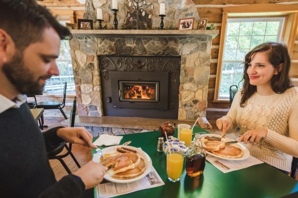 A COUPLE HAVE PANACAKE IN A PANCAKE HOUSE