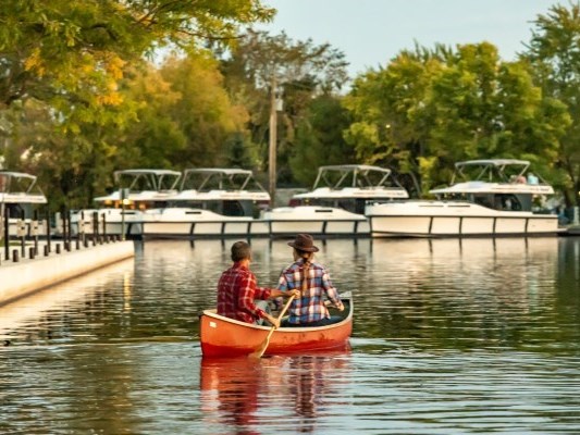 two people boating in a park
