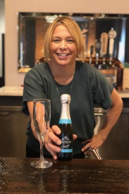 a staff serving beer