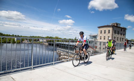 a man cycling near water