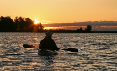 a man in an antique boat