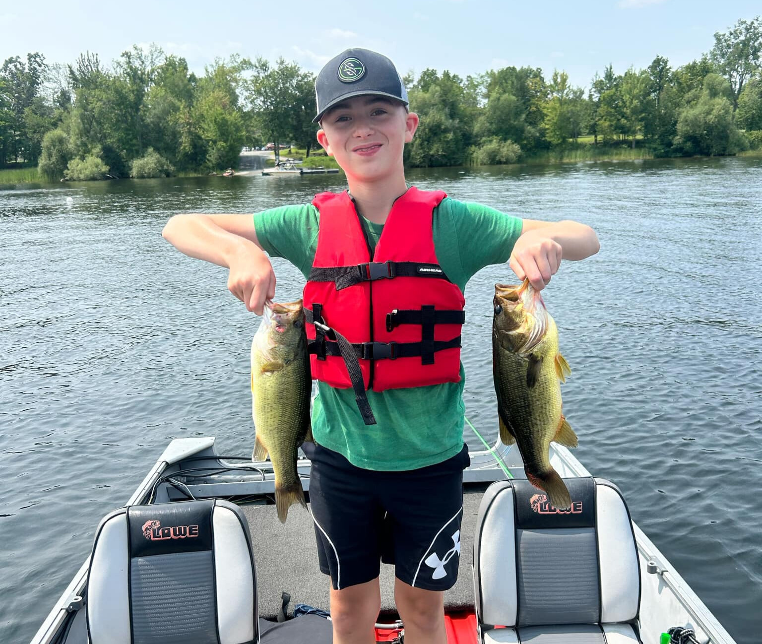Child holding fish.