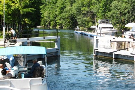 two white boats on a river