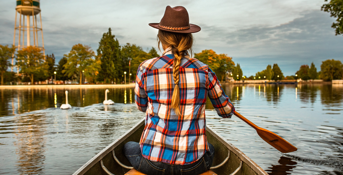 a girl boating in a park