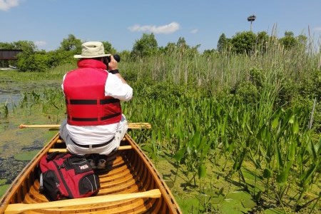 a man taking picture on a boat