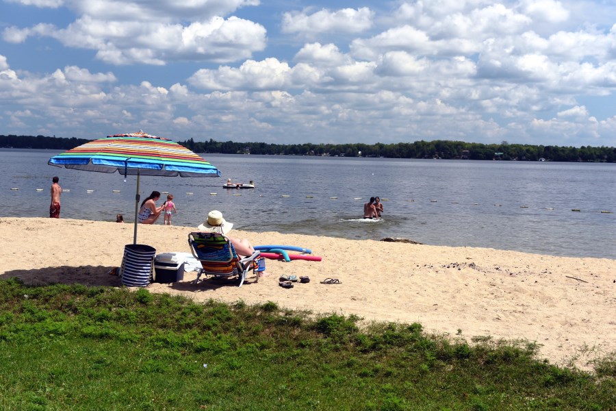 Beachgoers relishing the sun, sand, and refreshing waters