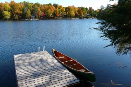 a green canoe on the lakeside