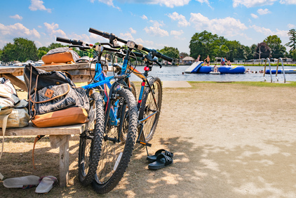 Two bikes parking in a park