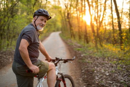 a man cycling on a road