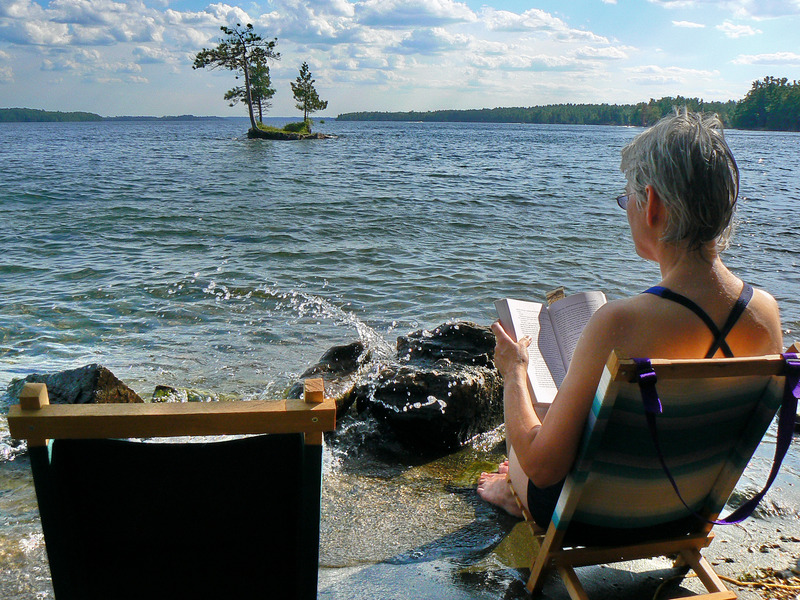 a woman reading in a beach