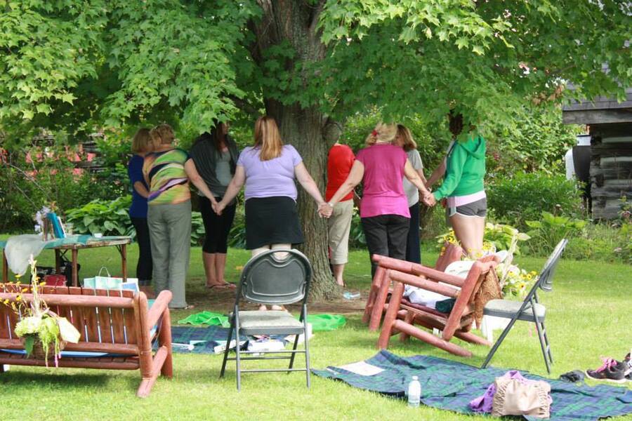 A group of women doing yoga outdoor