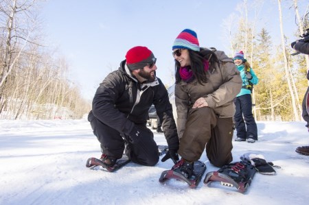 Two people snowshoeing in the winter