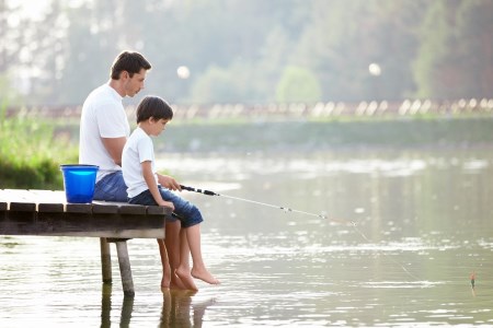 a father goes fishing with his son