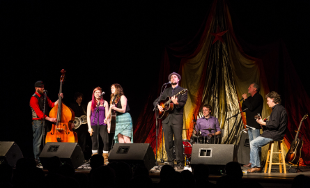 musicians on a brightly lit stage