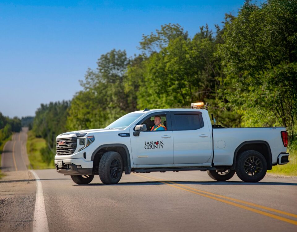 Lanark County public works truck stopped on a rural road