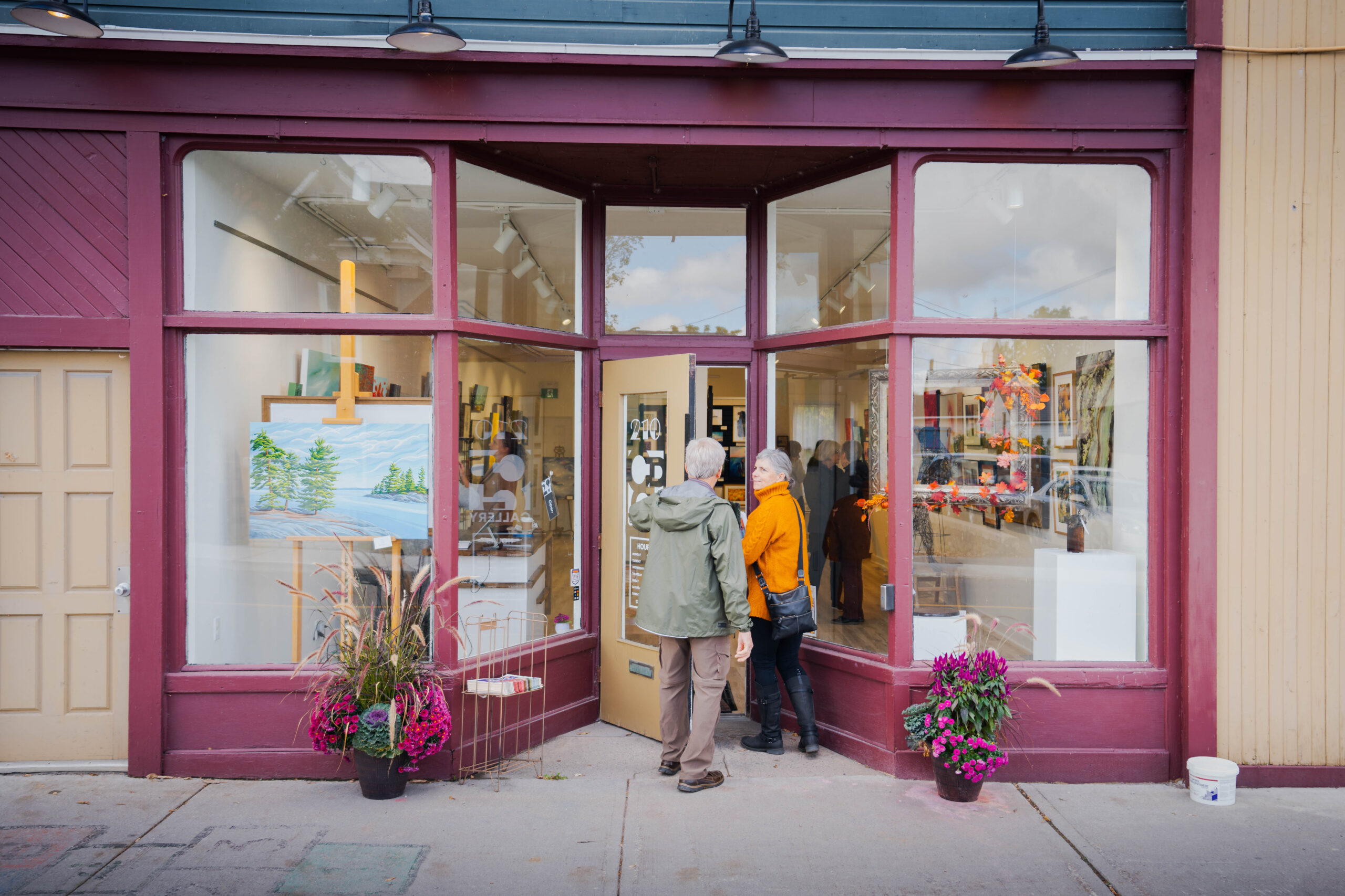 two people entering an art gallery.