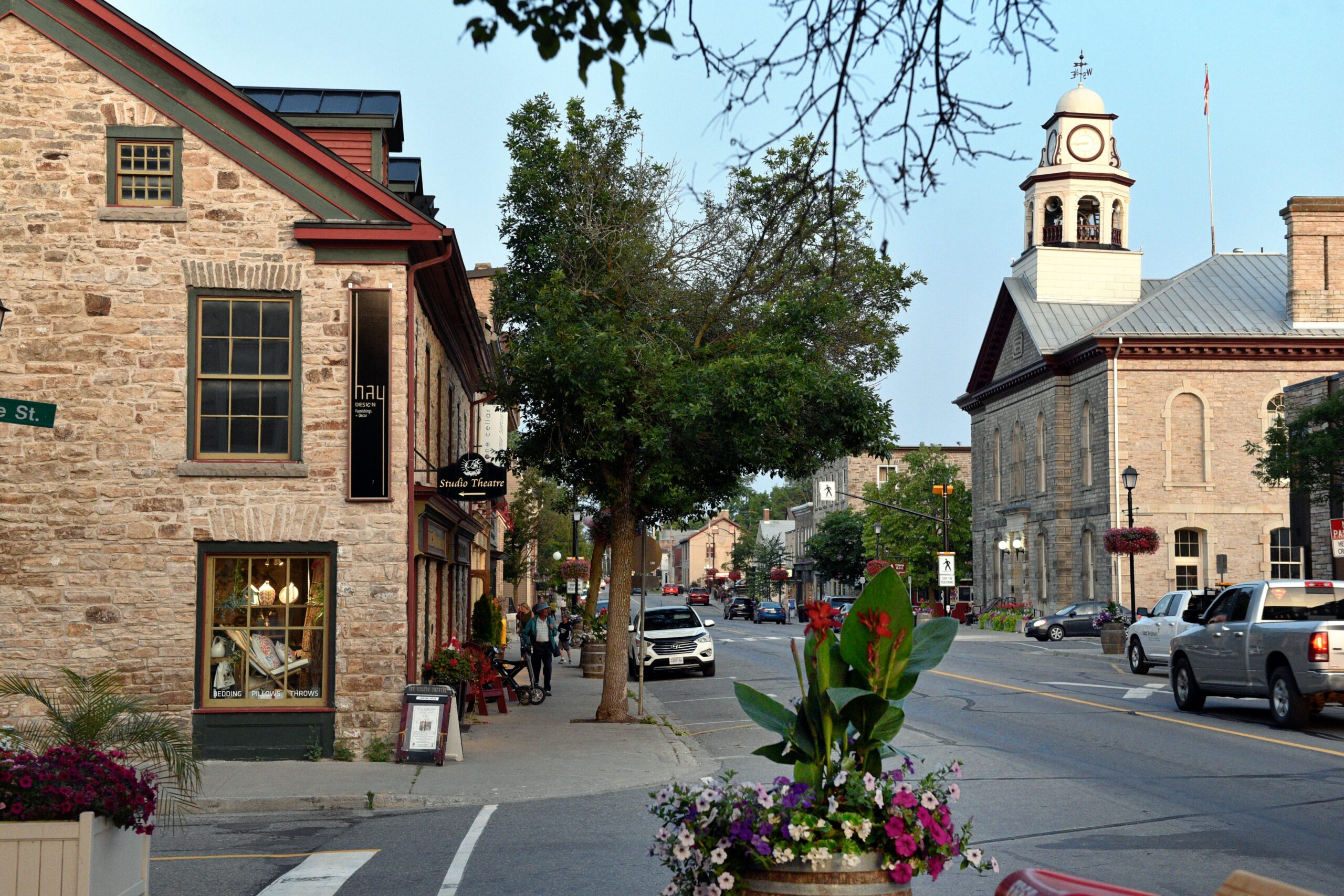 downtown Perth, with local businesses and cars parked on the side of the road.